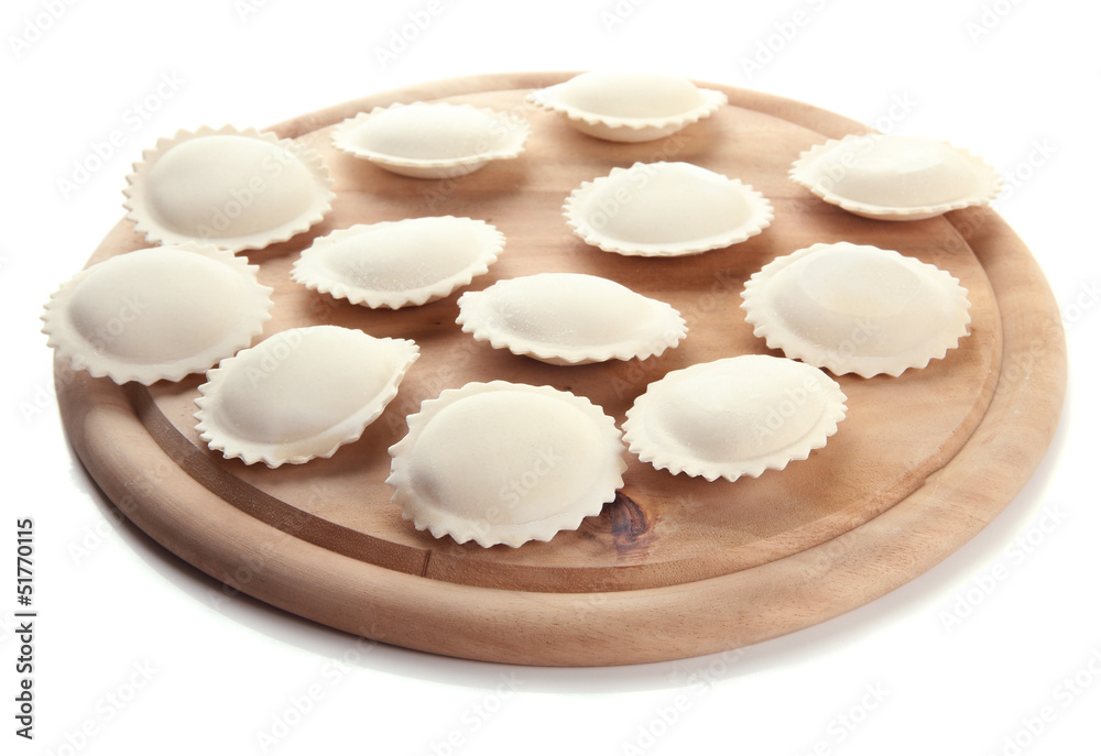 Raw dumplings on wooden desk, isolated on white