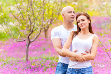 Wall Mural - Loving couple on floral field