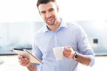 Wall Mural - Man using digital tablet