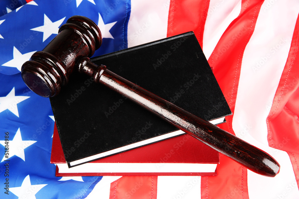 Judge gavel and books on american flag background