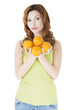 © Piotr Marcinski - Happy woman with orange fruits