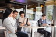 © luckybusiness - Businesspeople in cafe