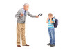 © Ljupco Smokovski - Angry grandfather holding a belt and threatening on his nephew