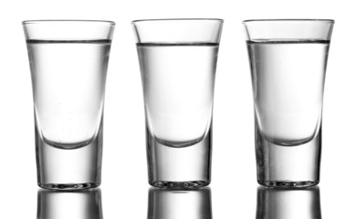Wall Mural - Three glass of vodka isolated on white