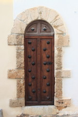 Canvas Print - Wooden medieval style front door in Ibiza Town, Spain