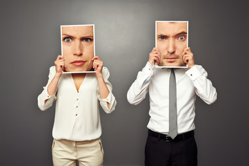 Wall Mural - man and woman holding photos