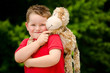 Portrait of boy playing with his stuffed animal pet