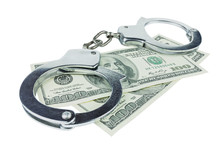 Handcuffs With Money Isolated In White Background