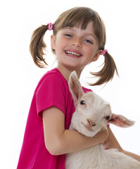 happy little girl with little goat