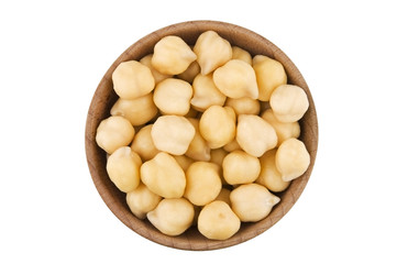 Wetted chick peas in wooden bowl isolated on white