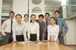 © xixinxing - Office team standing near the desk, portrait