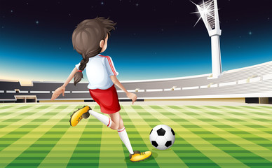 Poster - A girl playing soccer at the field