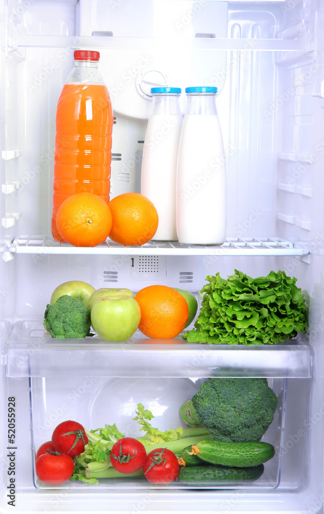 Open refrigerator with vegetarian food