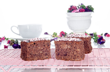 chocolate walnut cake on a cooling rack