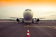 © Klemen Misic - Commercial airplane parking at the airport, with traffic cone in