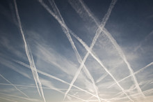 Airplane Trails Of Condesed Air In The Sky
