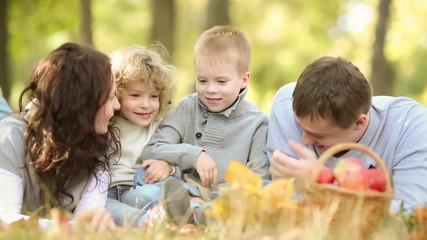 Poster - Happy family playing outdoors in autumn park