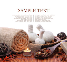 Spa massage border with rolled towel and compress balls