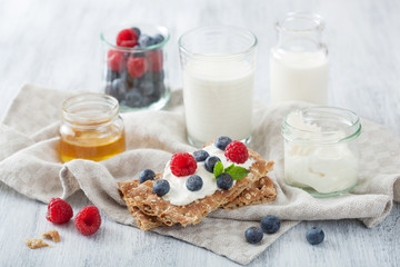 Wall Mural - crisp bread with creme fraiche and berries