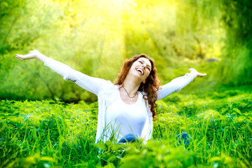 Wall Mural - beautiful young woman outdoors. enjoy nature