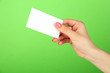 © Africa Studio - Female hand holding business card, on color background