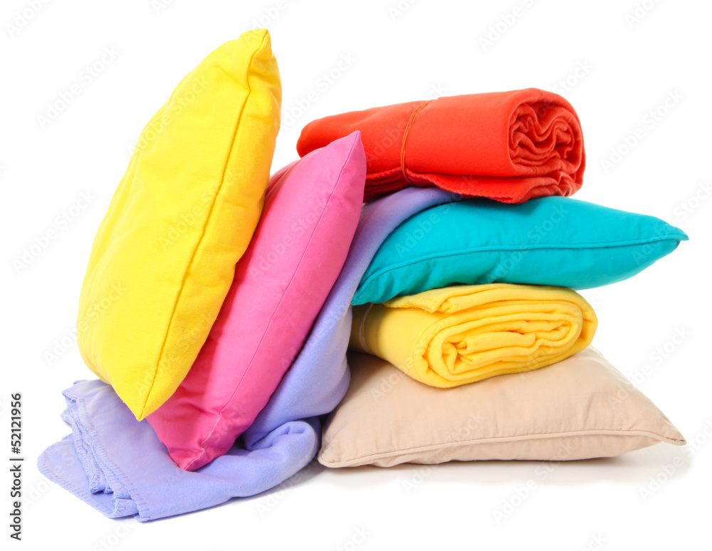 Bright pillows and plaids, isolated on white