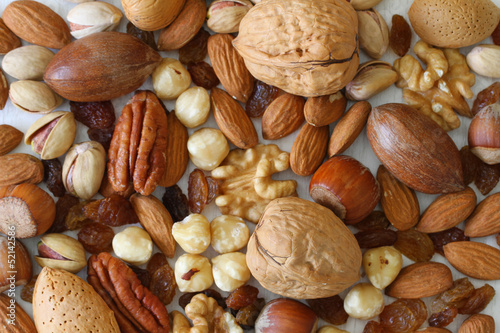 Fototapeta na wymiar Selecion of nuts, almonds and sultanas, close up