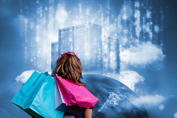 Fototapete - Girl with shopping bags looking at  data server on top of earth