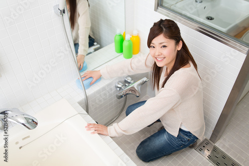 お風呂を掃除する女性 Stock Photo Adobe Stock