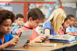© Monkey Business - Pupils In Class Using Digital Tablet
