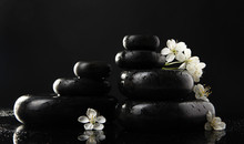 Spa Stones And White Flowers Isolated On Black