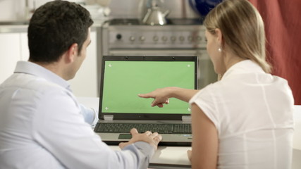 Man and woman with laptop computer for email and internet