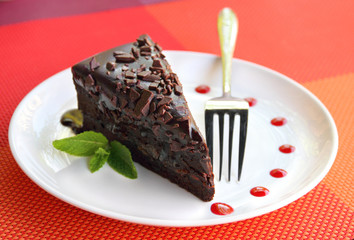 Wall Mural - A piece of chocolate cake on a plate