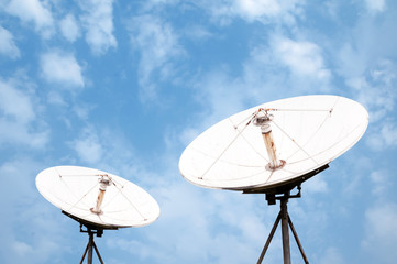 satellite dish antennas under sky