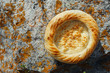 Traditional eastern lepeshka nan - white flat bread baked in old