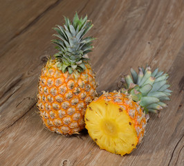 two Pineapples on wooden grunge background