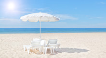 Beautiful White Beach Umbrella And Sun Bed On The Beach. For The