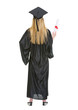 © Alliance - Full length portrait of woman in graduation gown showing diploma