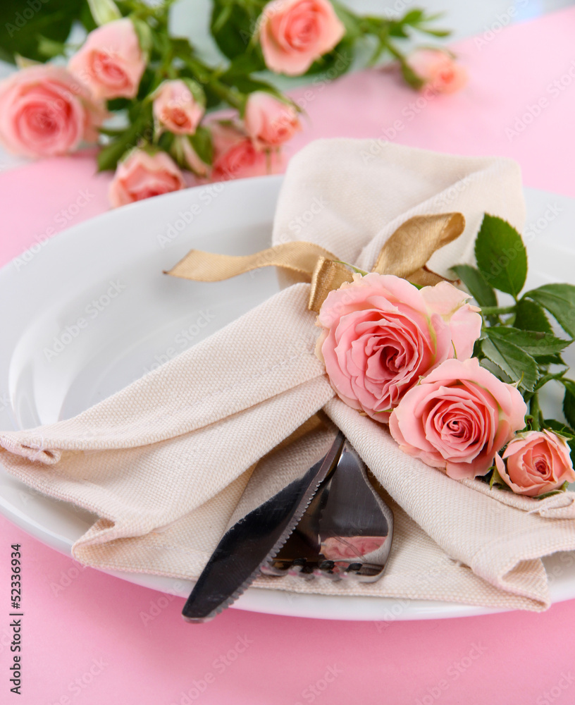 Served plate with napkin and rose close-up
