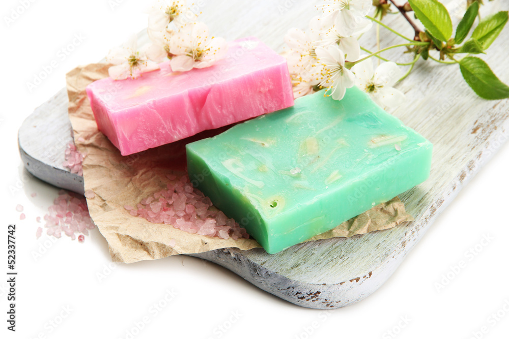 Natural handmade soap on wooden desk, isolated on white