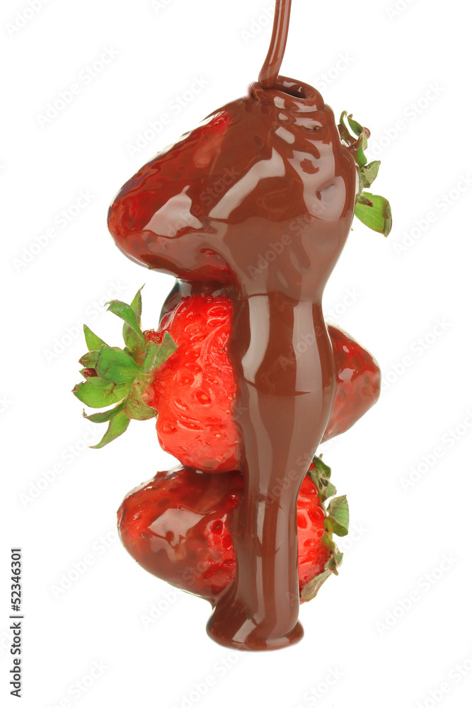 Strawberry dipped in chocolate fondue isolated on white
