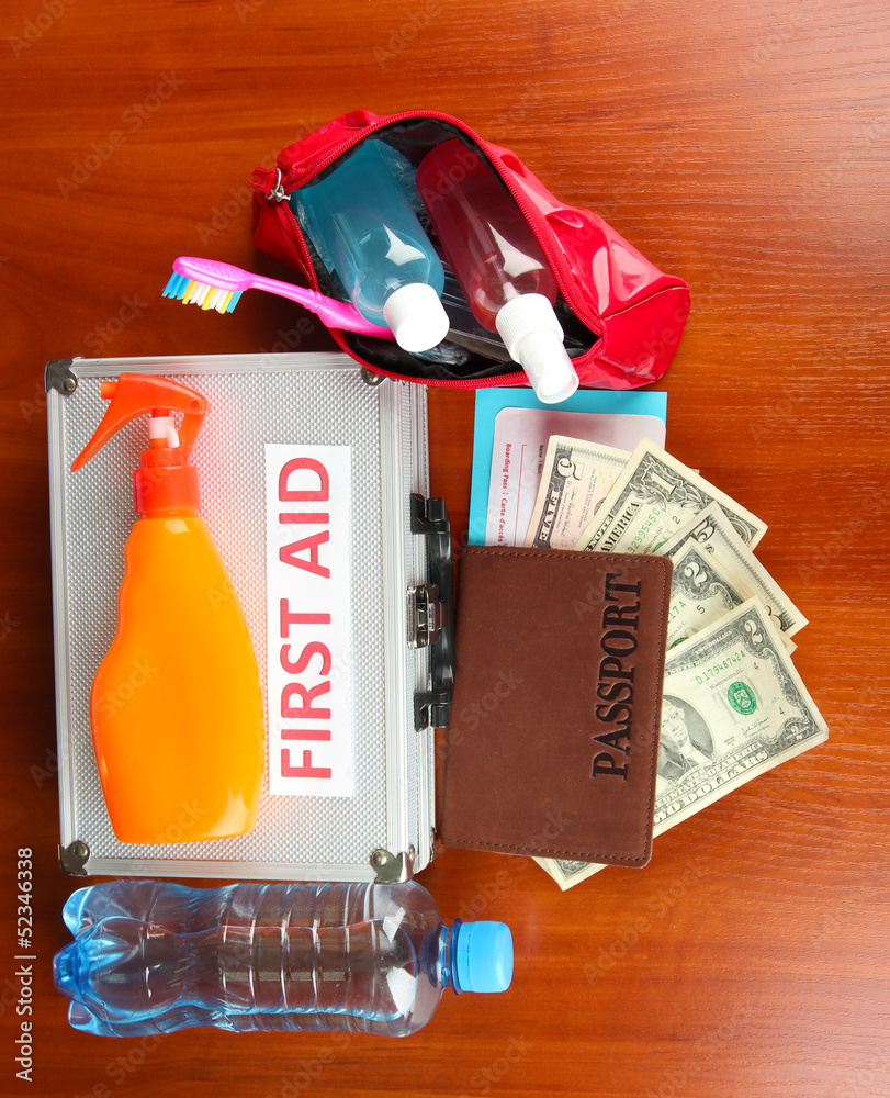 Travelling items on wooden background
