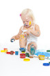 © Shchipkova Elena - Little girl bedaubed with bright colors