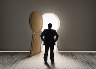 Poster - Buisnessman looking at keyhole shape door revealing light