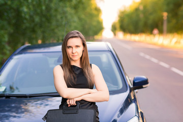 Wall Mural - Beautiful businesswoman near her car