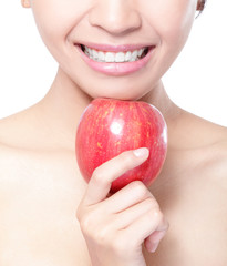 Canvas Print - young woman eating red apple with health teeth