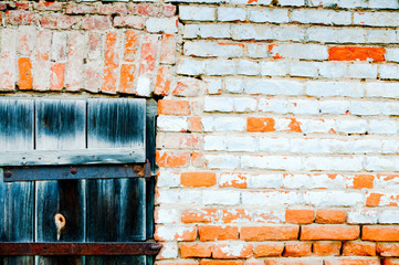 Gray wooden shutter destroyed by the time