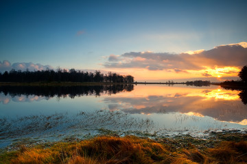 Fototapete - calm sunset over lake in Dwingelderveld