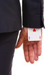 Businessman with ace card hidden under sleeve.