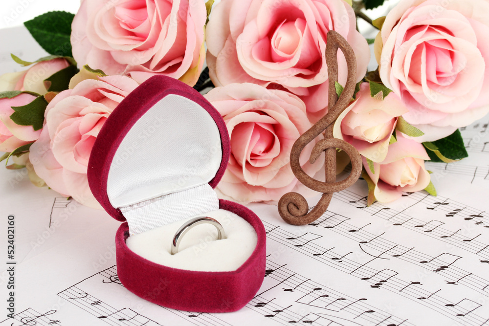 Treble clef, roses and box holding wedding ring